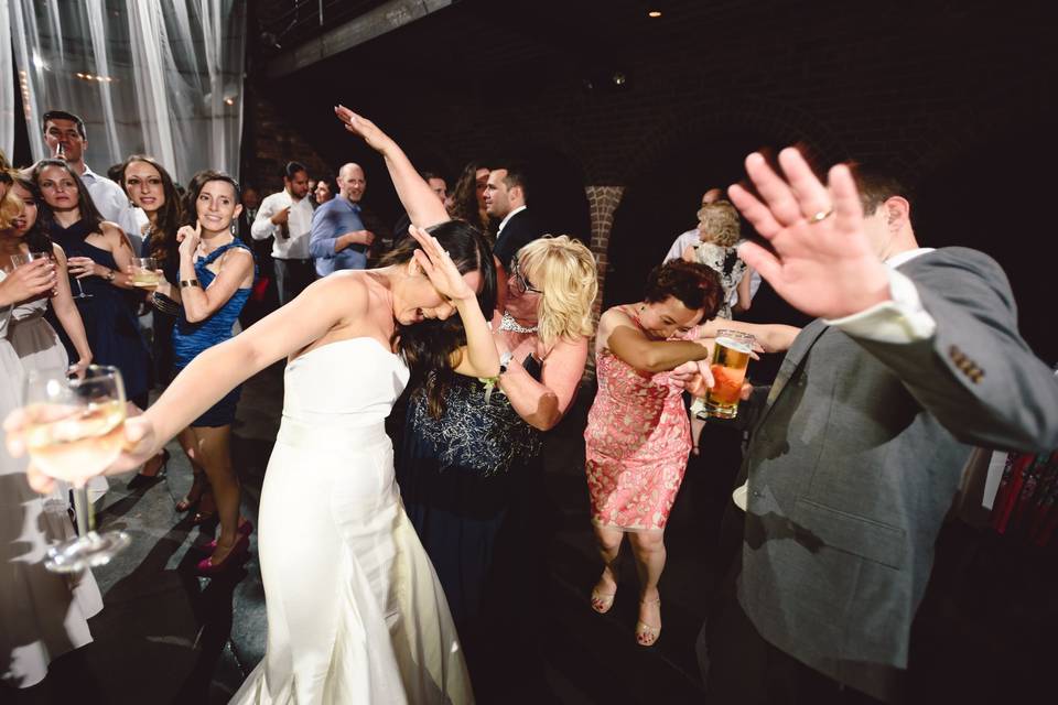 The couple with their guests dancing