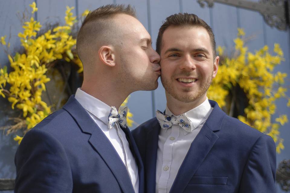 Groom kissing a groom