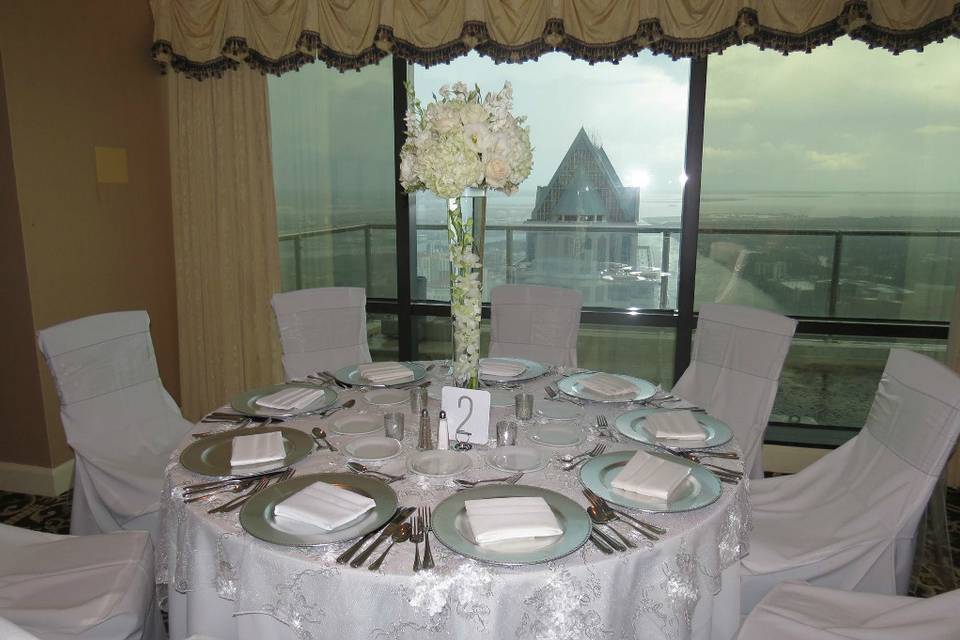 Table setting and raised floral centerpiece