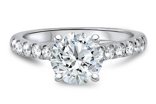 Classic solitaire engagement ring with accent diamonds on band.