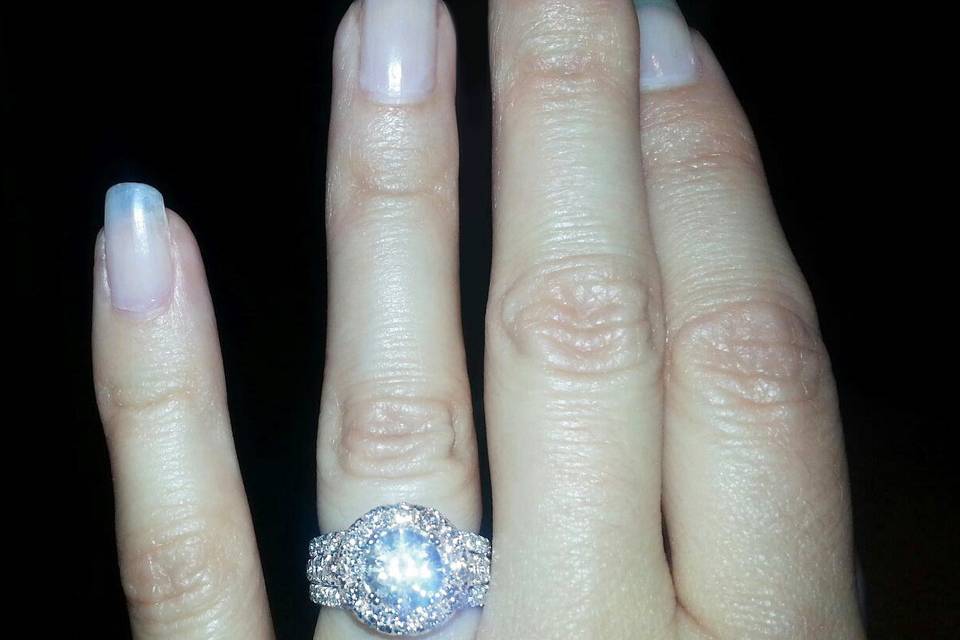 Theresa's sparkling pavé halo engagement ring (designer: Gabriel NY)