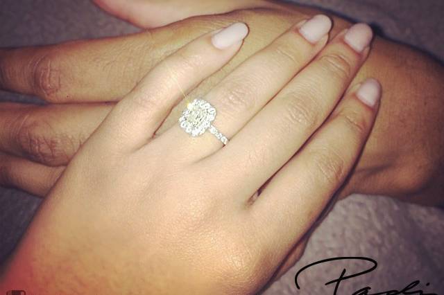 Taneisha's halo engagement ring with and elongated cushion cut center diamond.