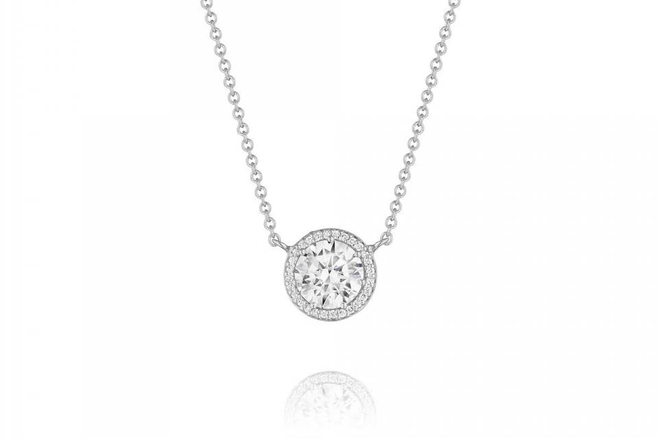 Our most liked necklace of all time on Pinterest! White gold halo pendant with diamonds.