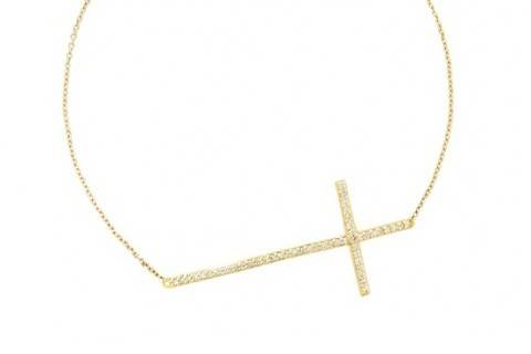 A lovely gift for a bride that values her faith: a diamond cross bracelet in yellow gold.
