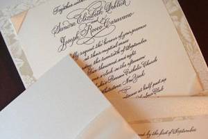 calligraphy wedding invitation in pearlized folder with god embellishment