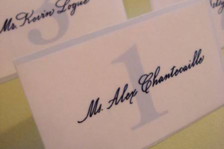 Calligraphy seating card in vellum envelope