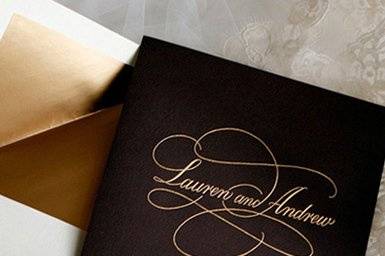 Gold engraved monogram wedding invitation