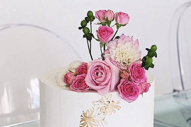 White cake topped with flowers