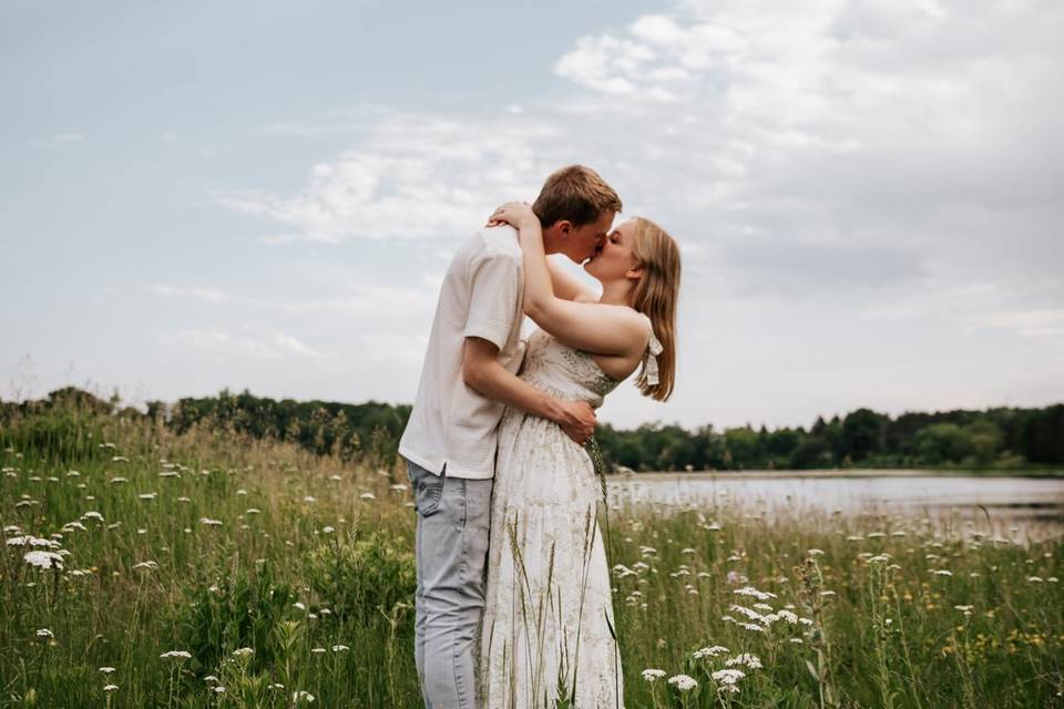 Engaged couple in flower field