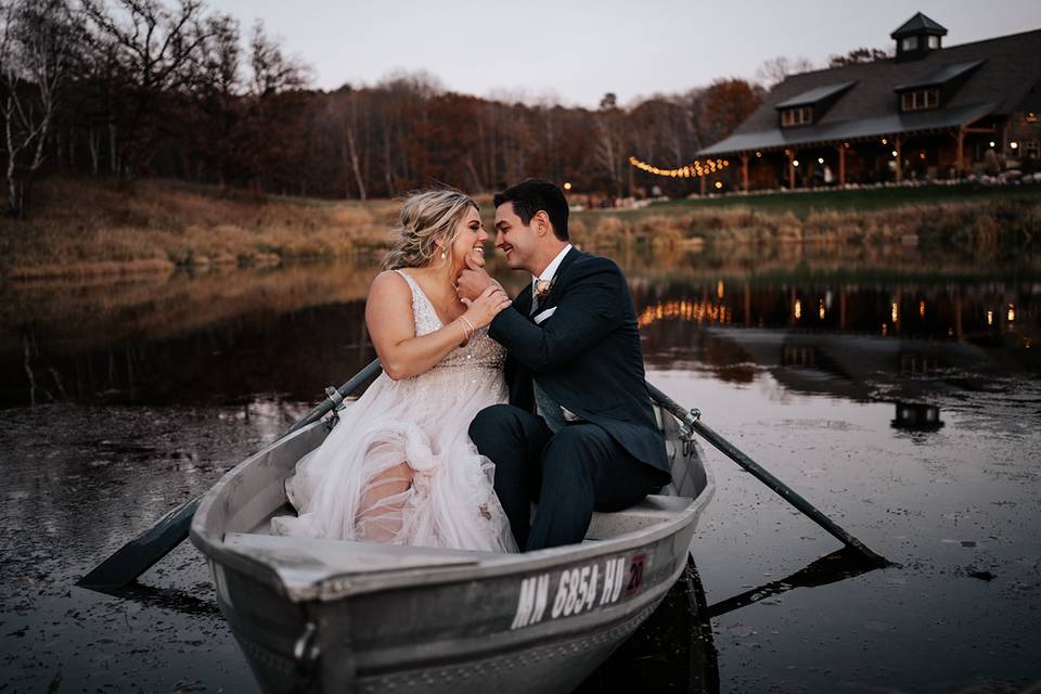 Bride and groom on rowboat