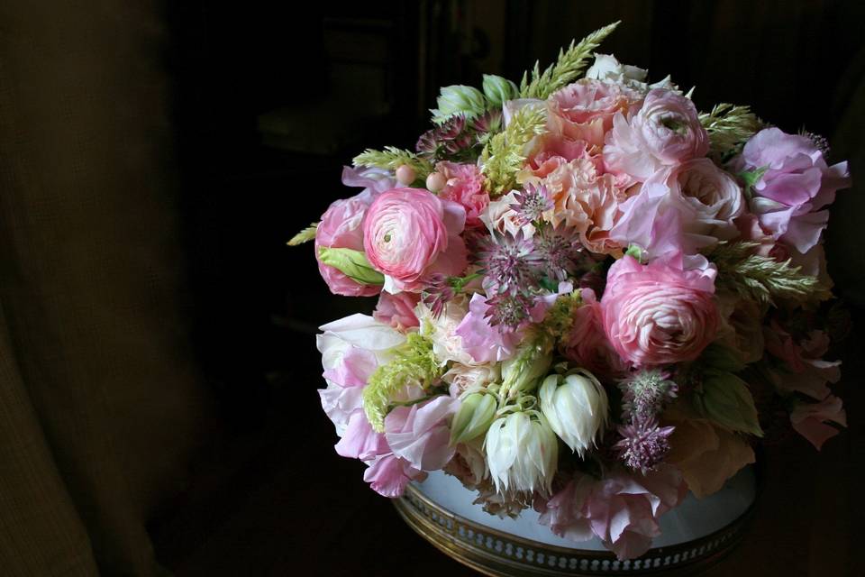 An abundant bridal bouquet by White Magnolia Designs.