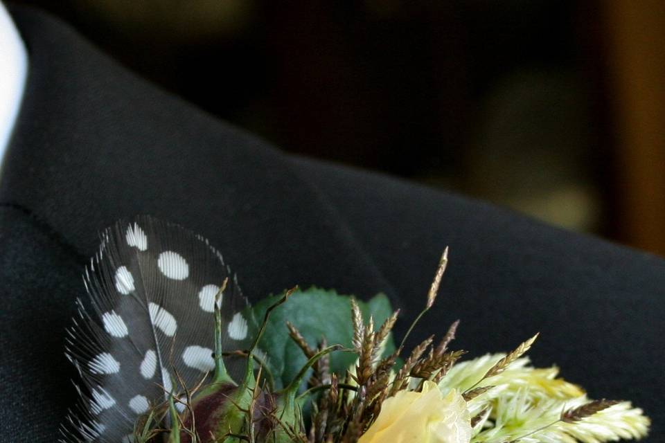 A Boutonniere for the groom full of texture with a classic masculine look by White Magnolia Designs.