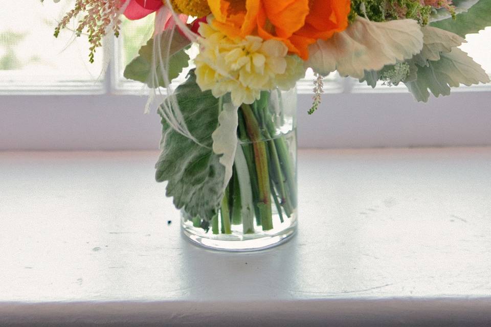 Coral Charm Peonies, poppies, astilbe and much more make up this gorgeous bouquet by White Magnolia Designs.