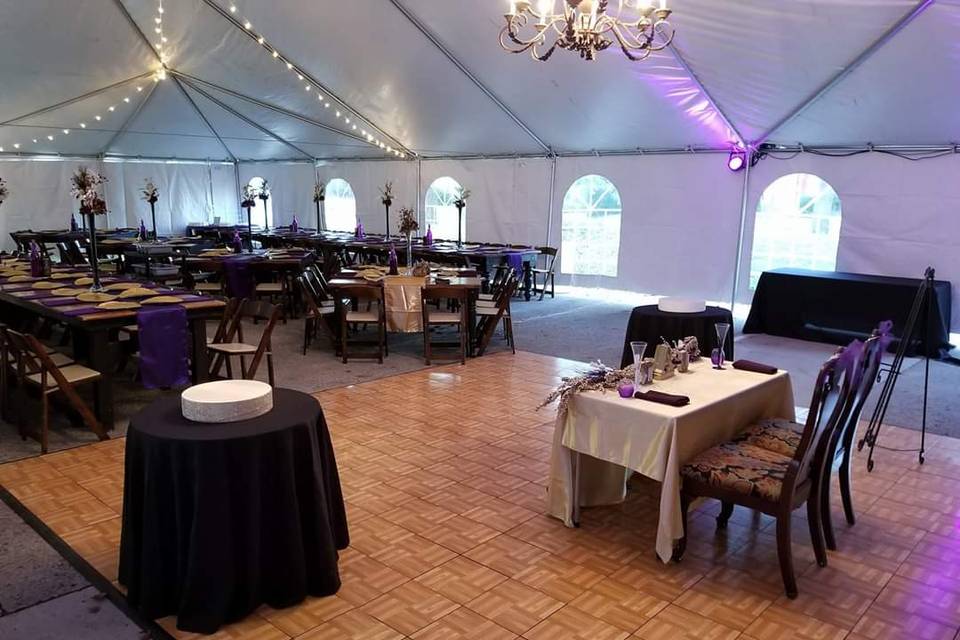 Tent setup with farm tables
