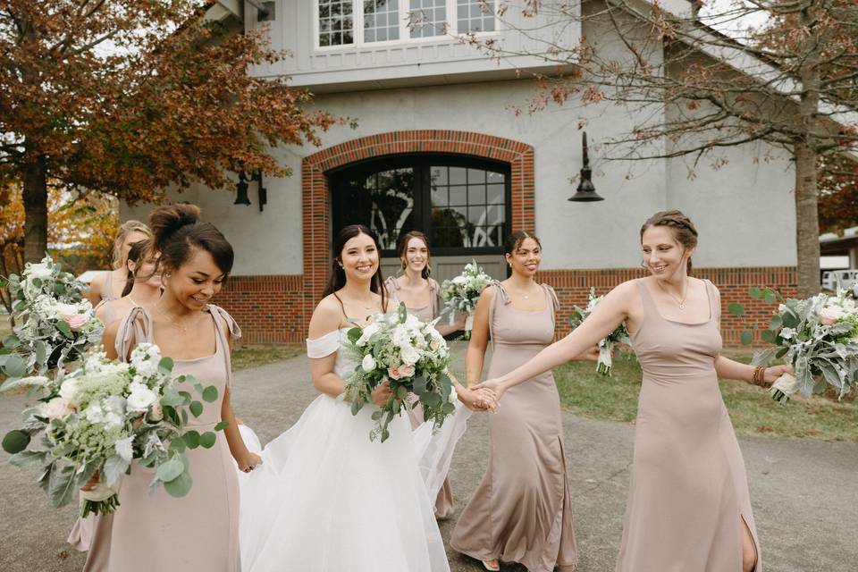 Bridesmaids outside barn