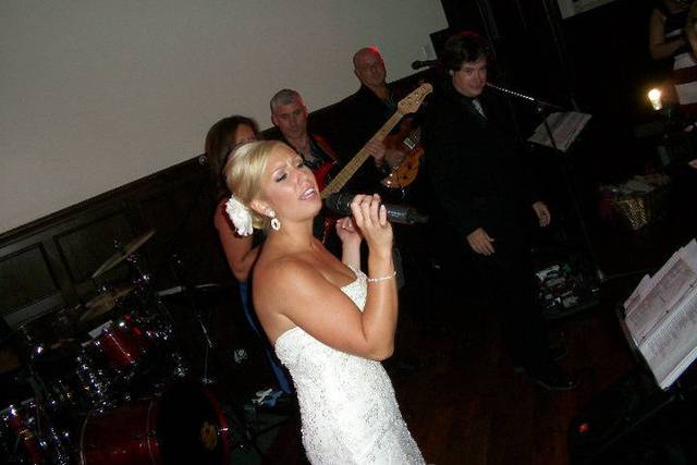 Bride singing with the band