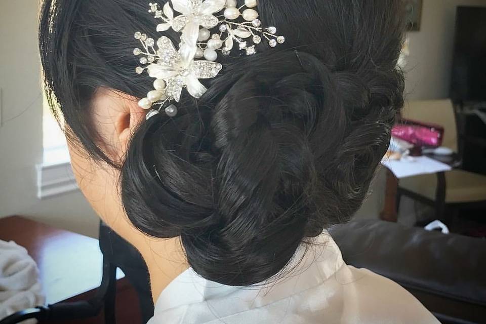 Back view of the bride's hair today #sidedo #sidebunwithbraid #sidedowithbraid #bridalhair #ocbridalhairmu #lisaleming