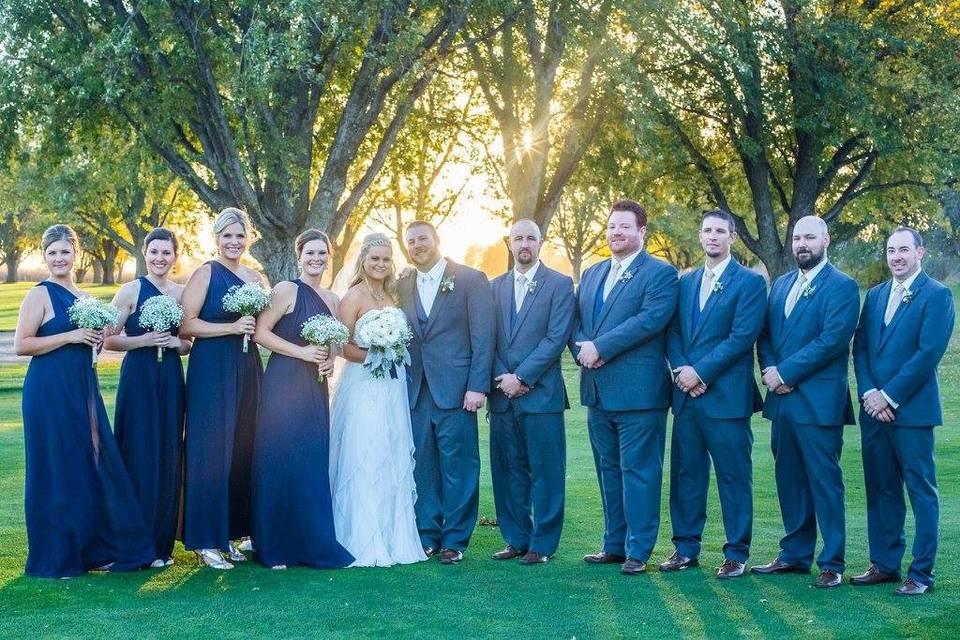 Bridesmaids and groomsmen with the newlyweds
