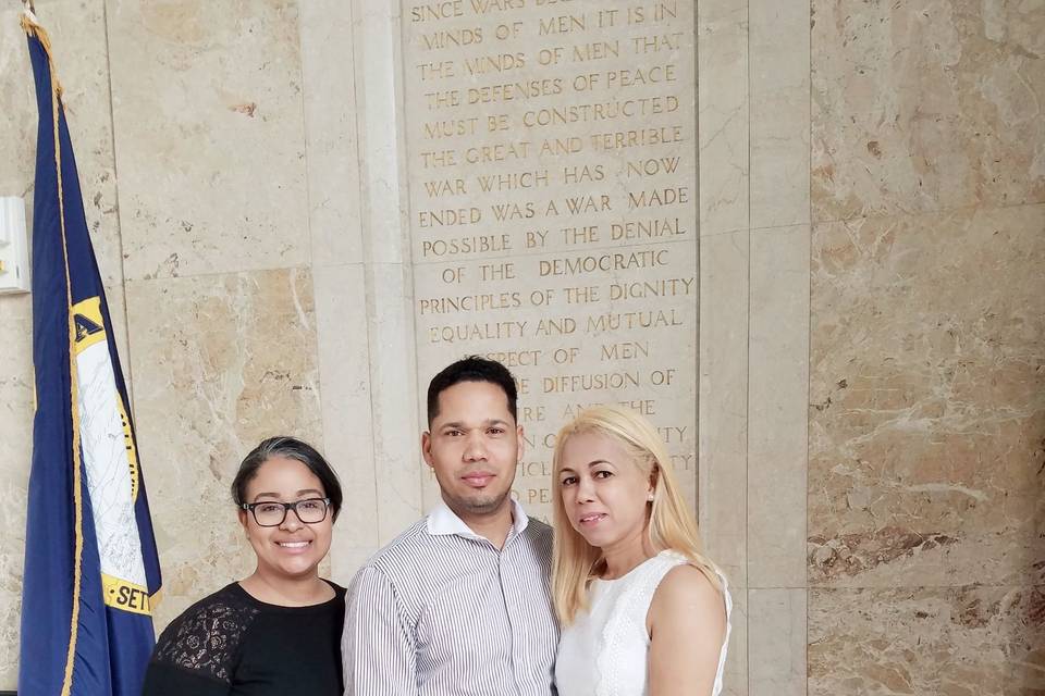 Newlyweds with their officiant