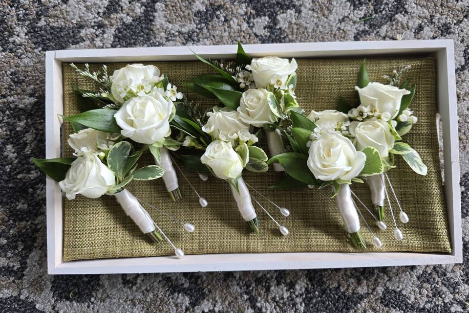 Green and white boutonnieres