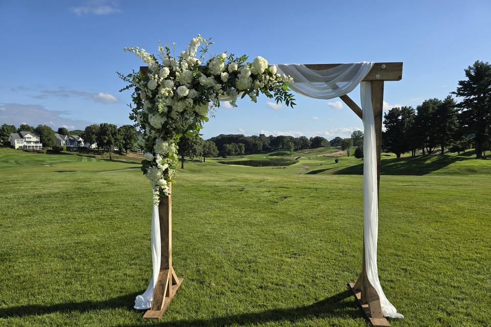 Green and white wooden arch