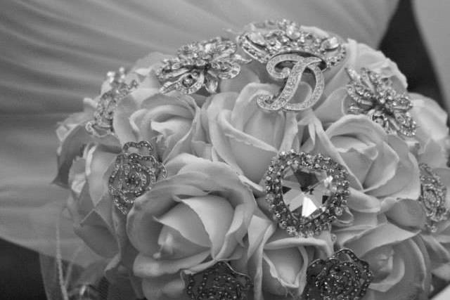 Creative portrait of the bride with her flower bouquet