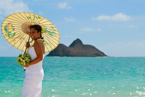 This was a delightful ceremony - she and her groom got married in the same spot that her parents had gotten married in 30 years earlier - by the same officiant! And that is her Grandmother's parasol!