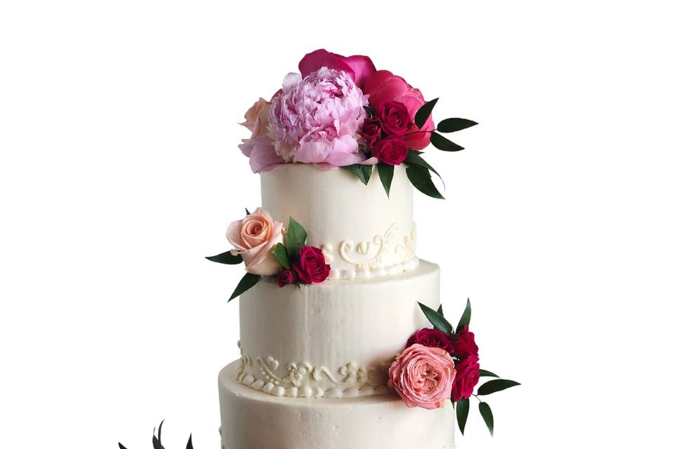 Four-tier cake with fresh flowers