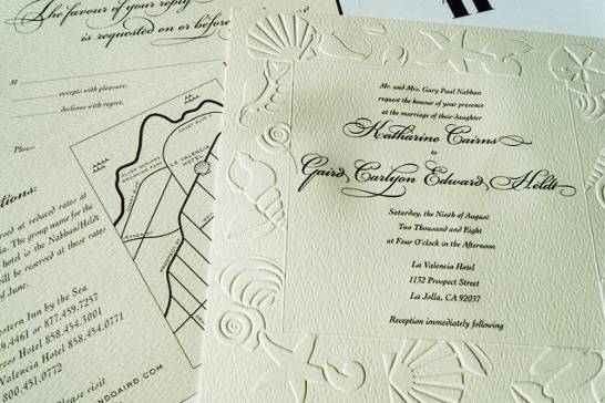 The combination of engraved type and embossed graphics on a textured paper give this invitation a lush, luxurious look.