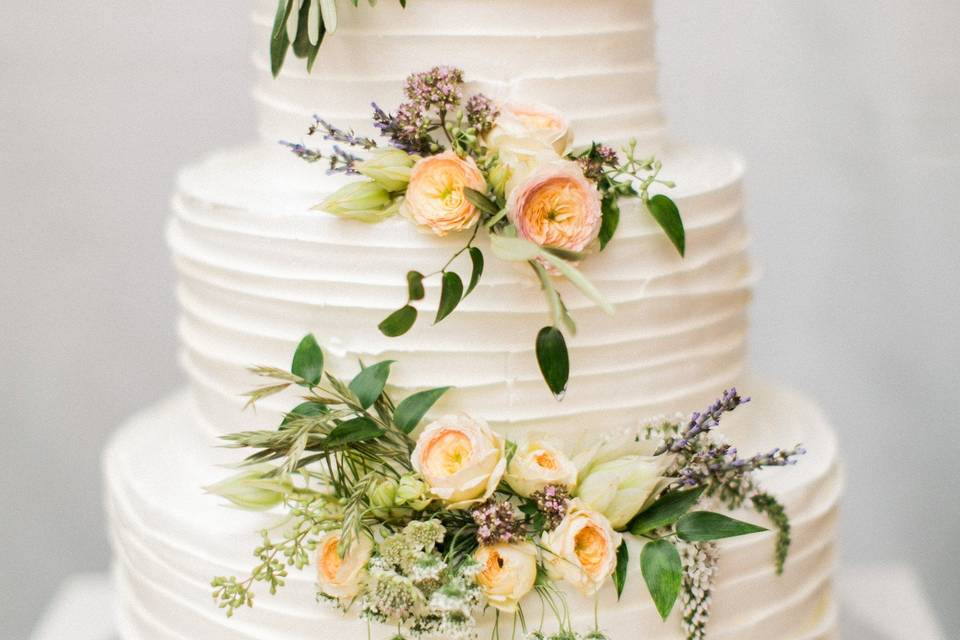 White wedding cake with flowers