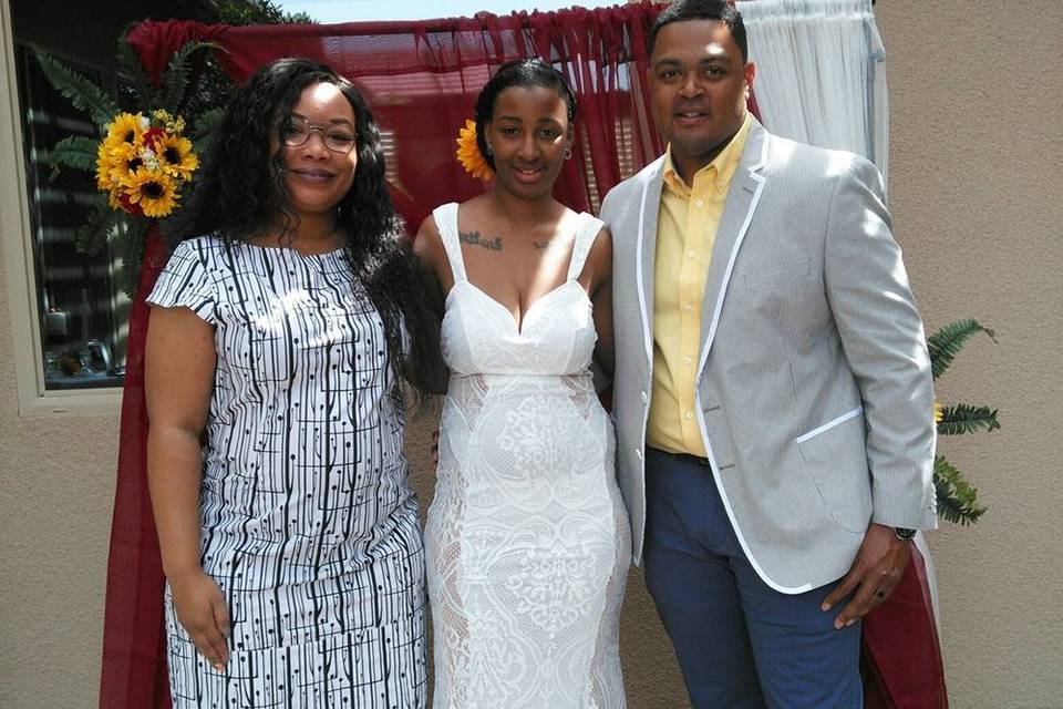 Bride and groom with their officiant