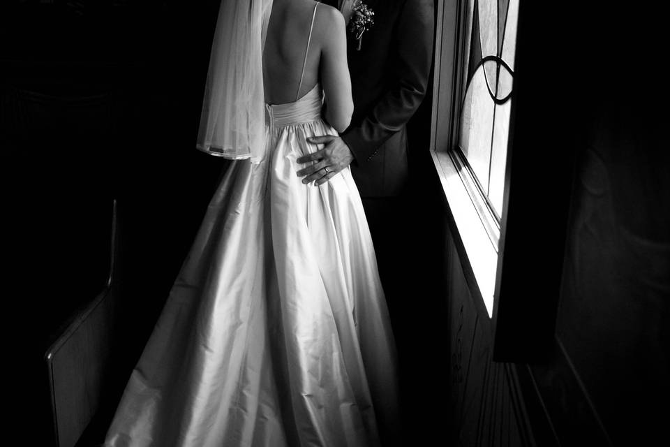 Bride beside window