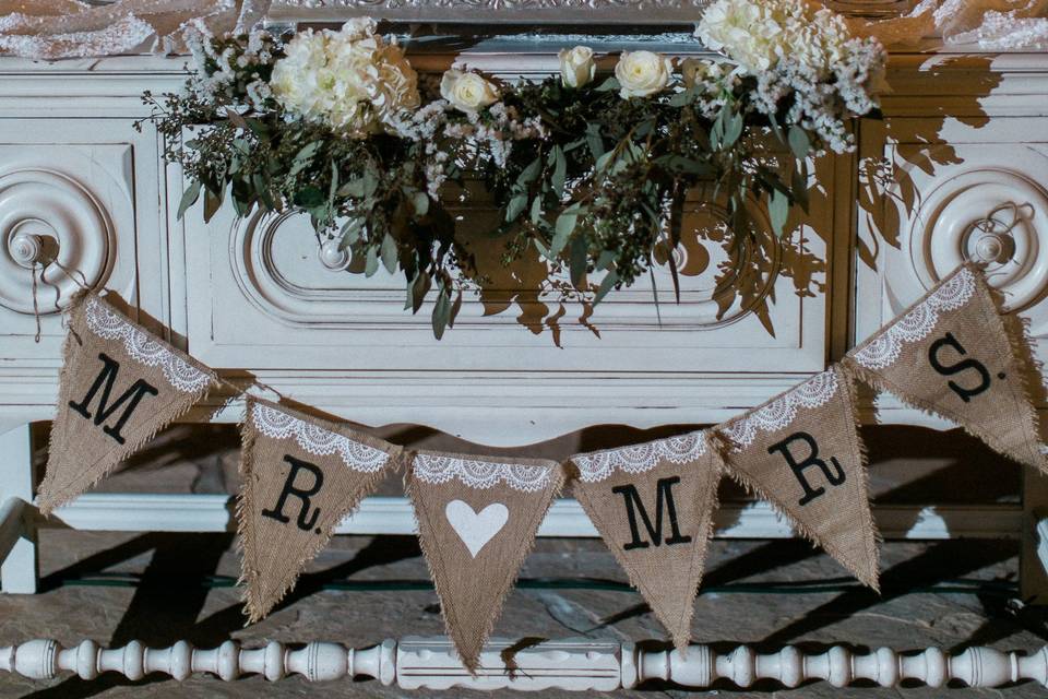 Rustic elegance. Rough, hand-frosted design clad in Italian whipped cream frosting and fresh flowers.