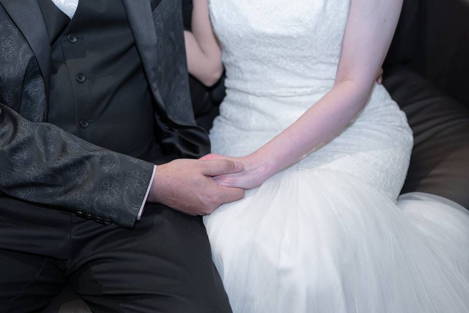 Bride and groom holding hands