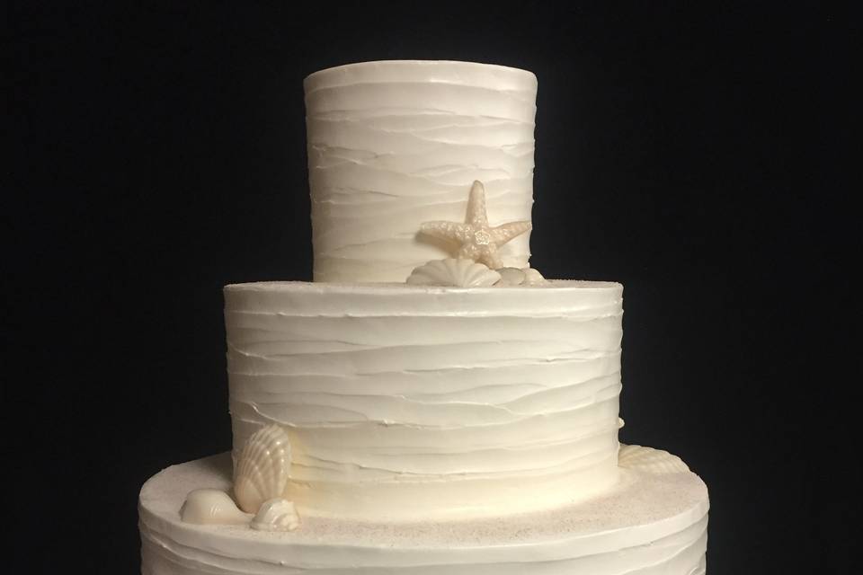 White wedding cake for beach wedding