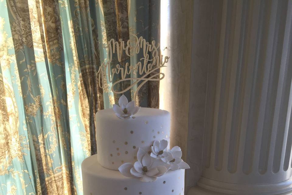 All white wedding cake with white flowers