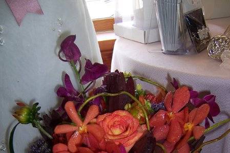 Fall tones using Roses, Dahlias, Protea, Hypericum Berries, Dendrobium and Mokara Orchids.