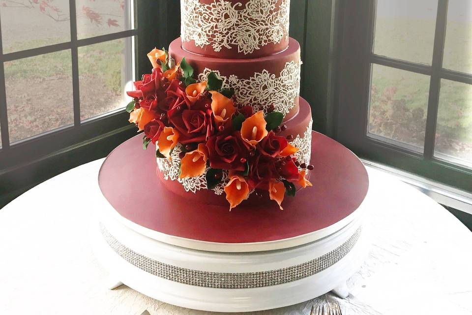 Red cake with roses and callas