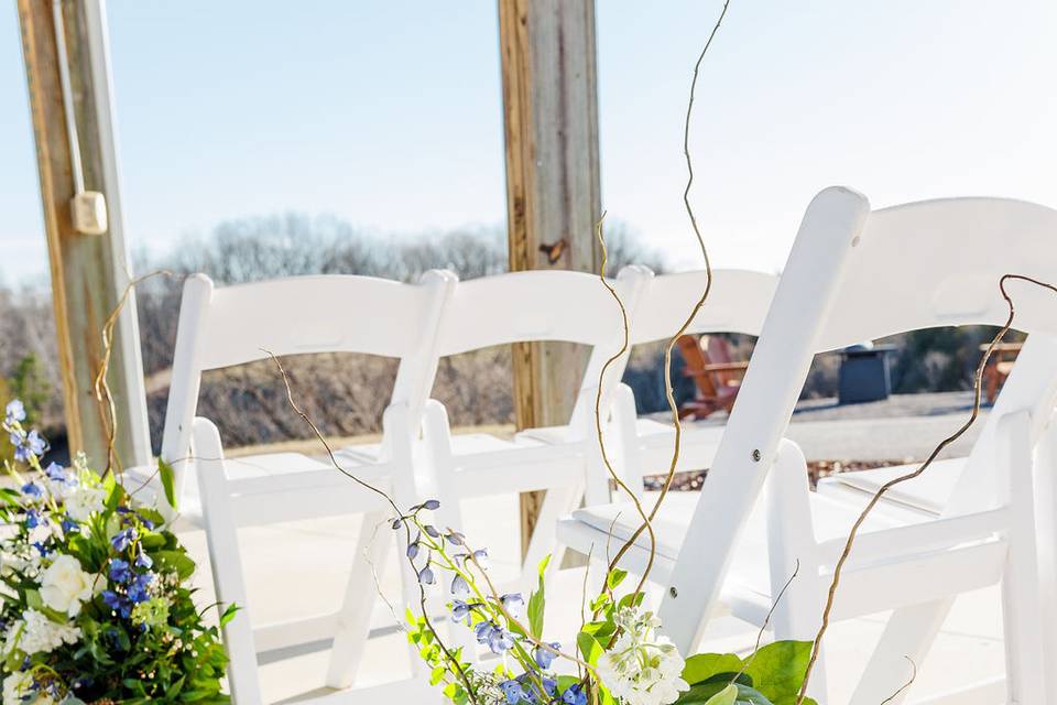 Flowers with wedding chairs