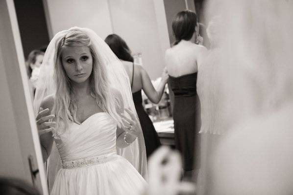 Bride giving herself one last look before walking down the aisle.