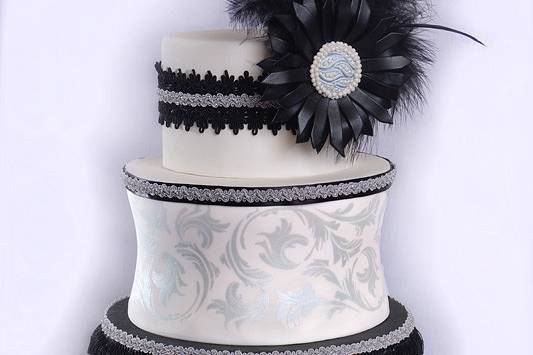 Black and white wedding cake with intricate detailing