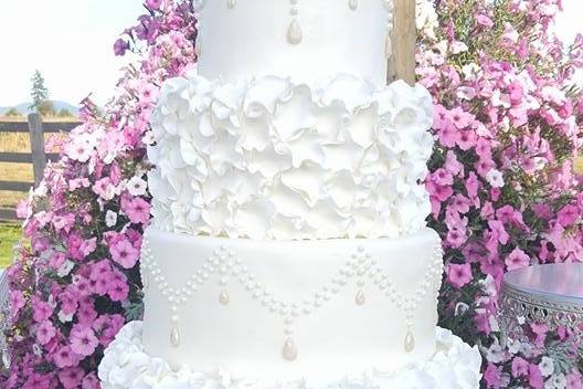 4-tier wedding cake with ruffled icing