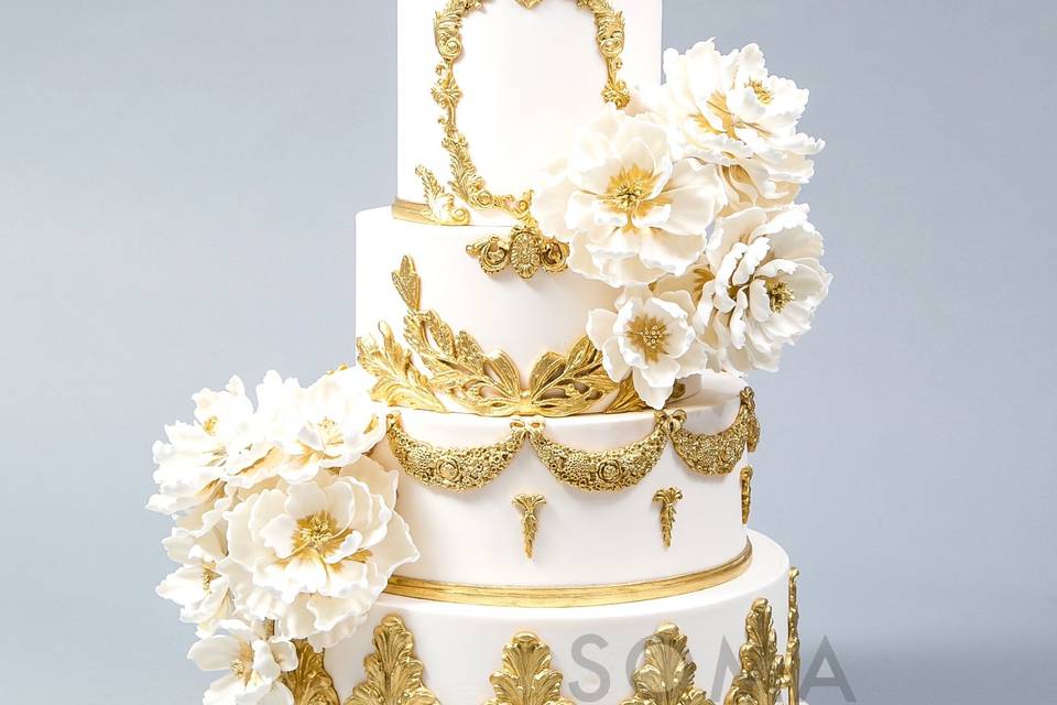 White peonies with ornate gold icing