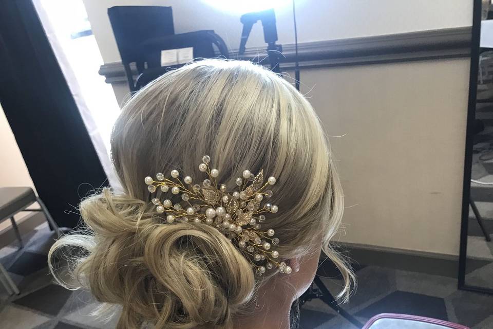 Messy low bun with baby's breath