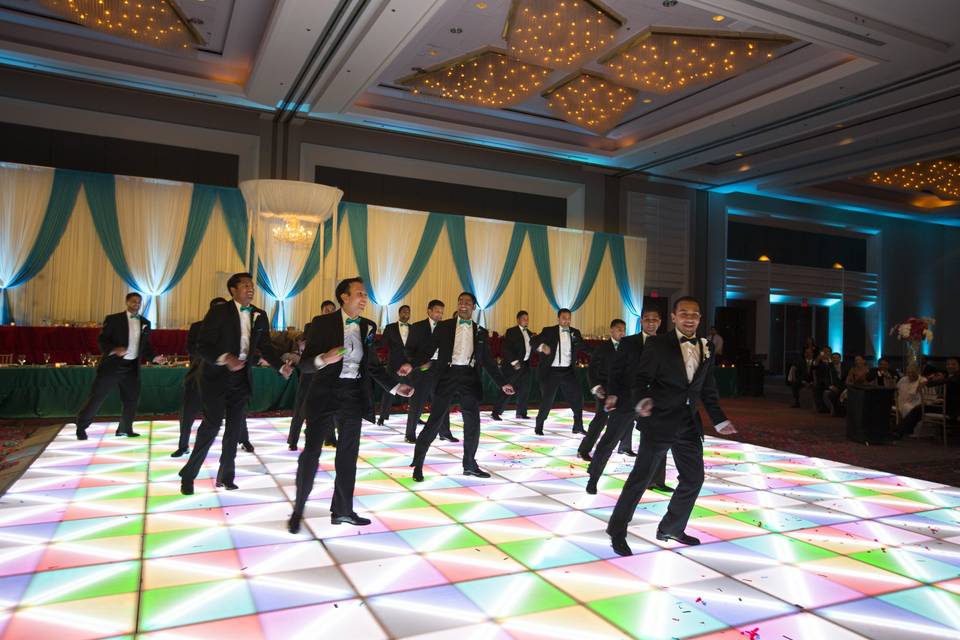 Groom and groomsmen dancing