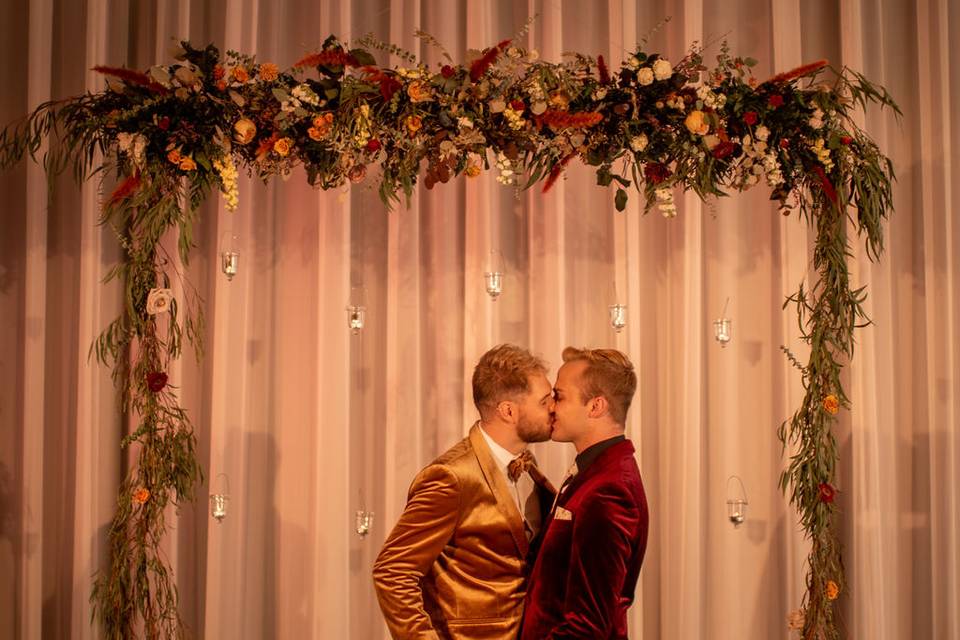 Grooms Kissing at alter