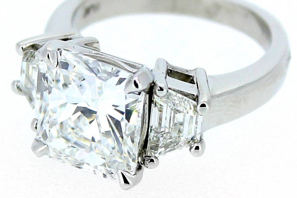 Cushion cut three stone ring