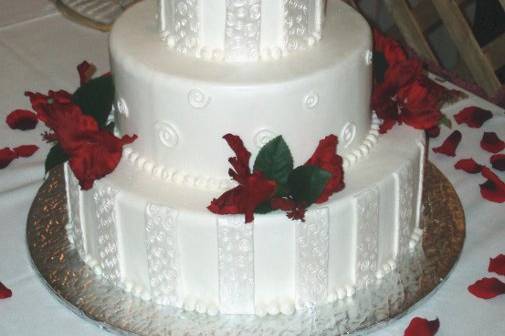 Fondant cake with strips and swirls.