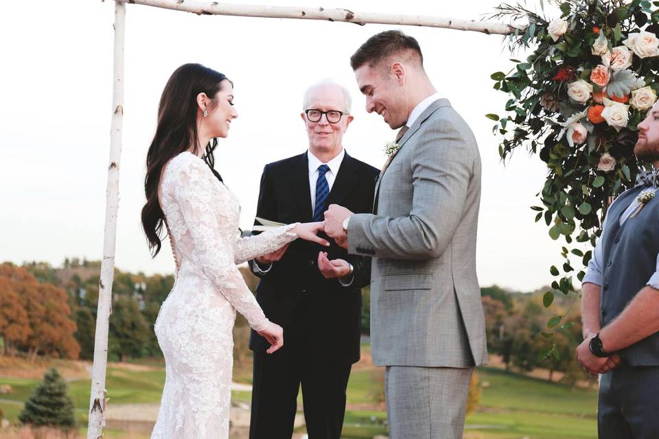 Couple exchanging rings