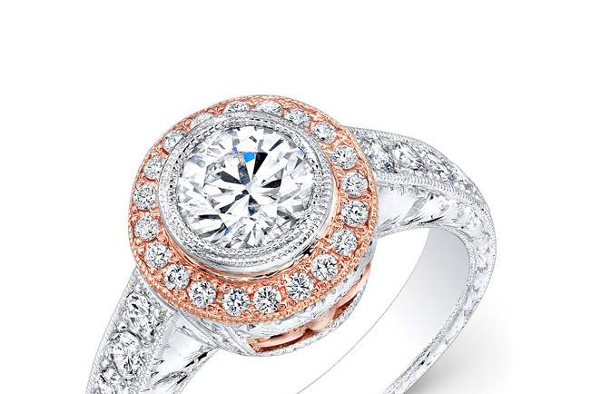 ENG-5514
This 18KT two-toned (White & Rose Gold) engagement ring features a halo design with 0.57PTS of pave-set side stones. The center stone is a round brilliant diamond that weighs 1.00CT.
Call 213.626.6012 or chat with us at www.goldempirejewelry.com to get the best deal for this beautiful piece!